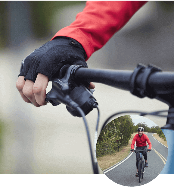 Person gripping bike handle