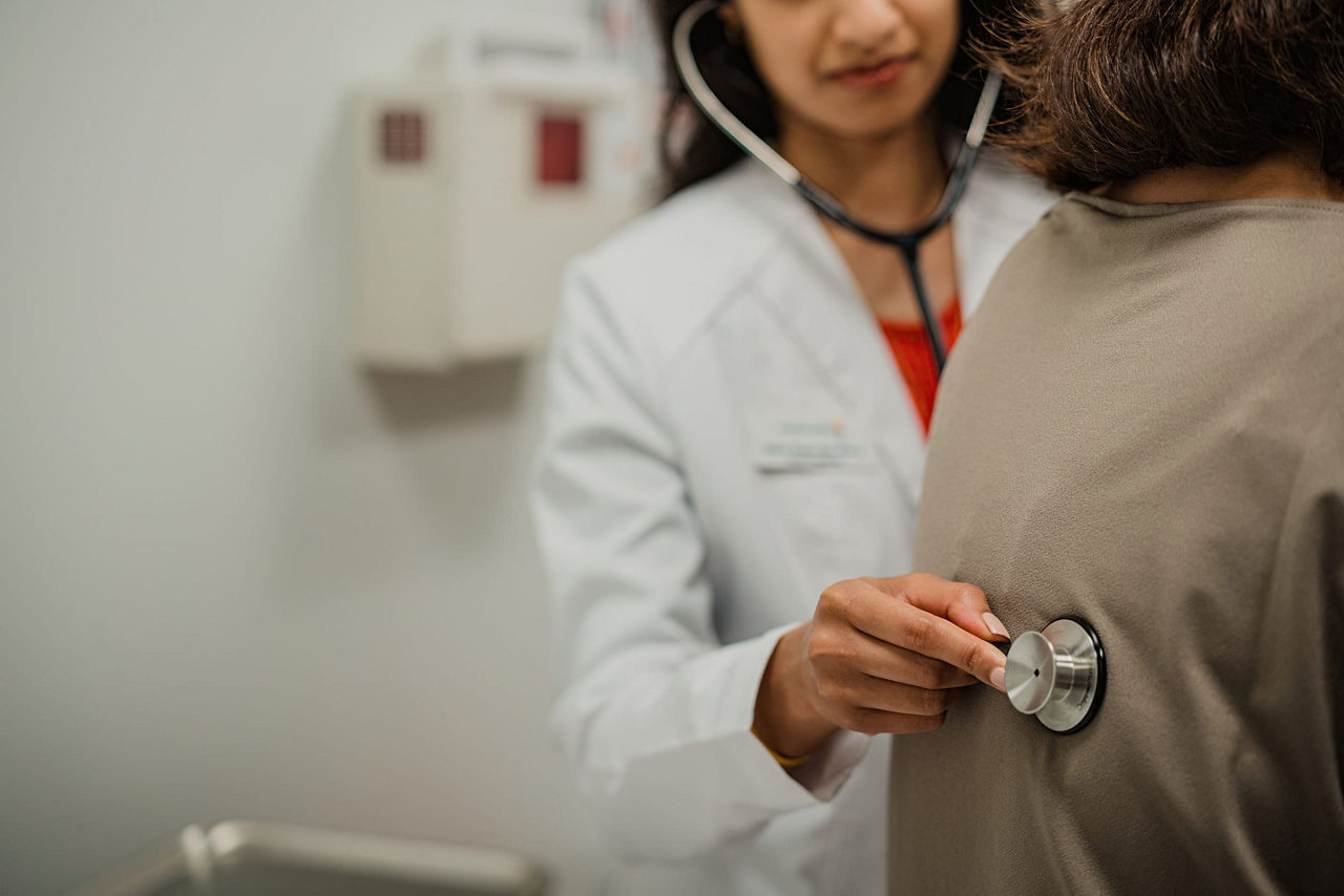 Female health care professional evaluating a patient