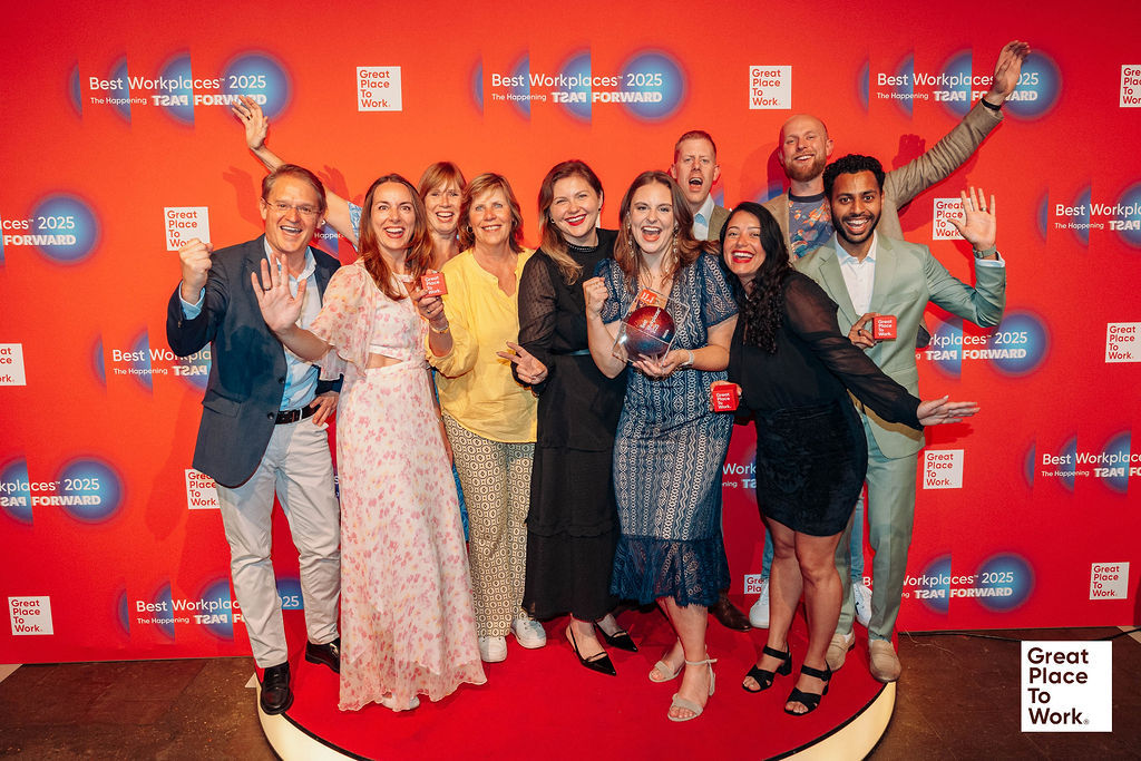 Group of employees showing award