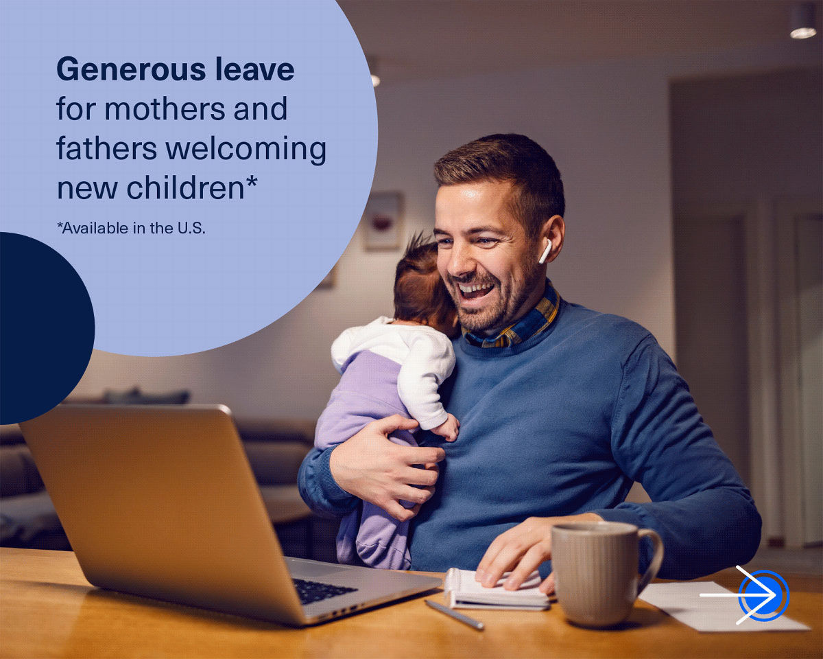 man with baby on computer