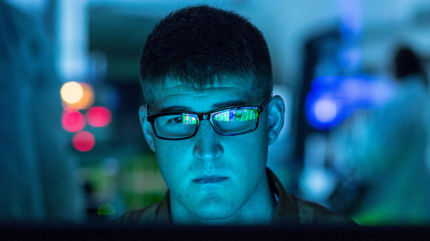 man looking at screen