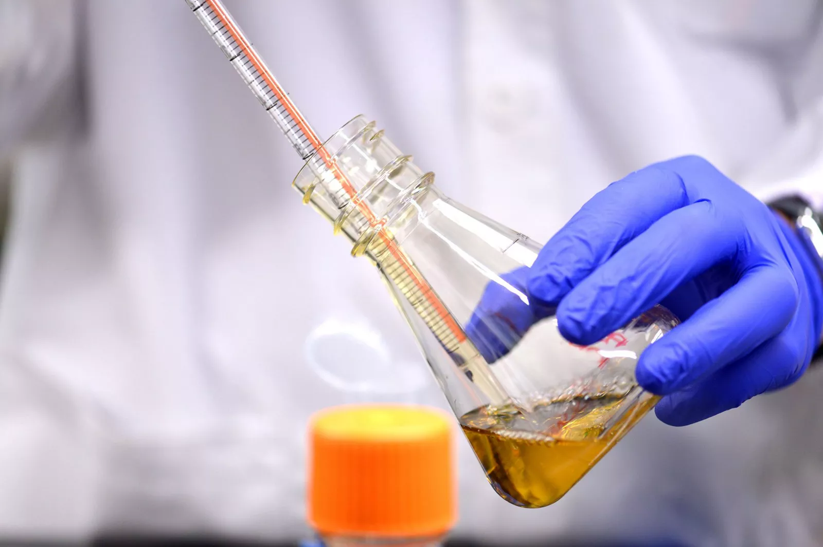 man-holding-beaker