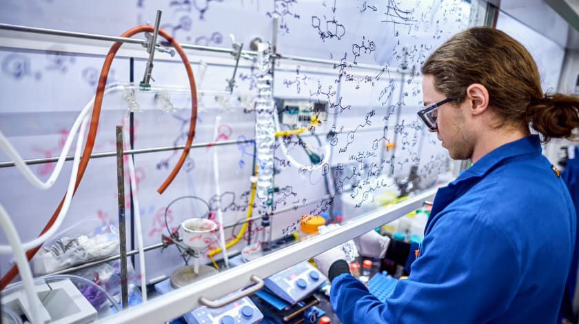 man in lab in blue