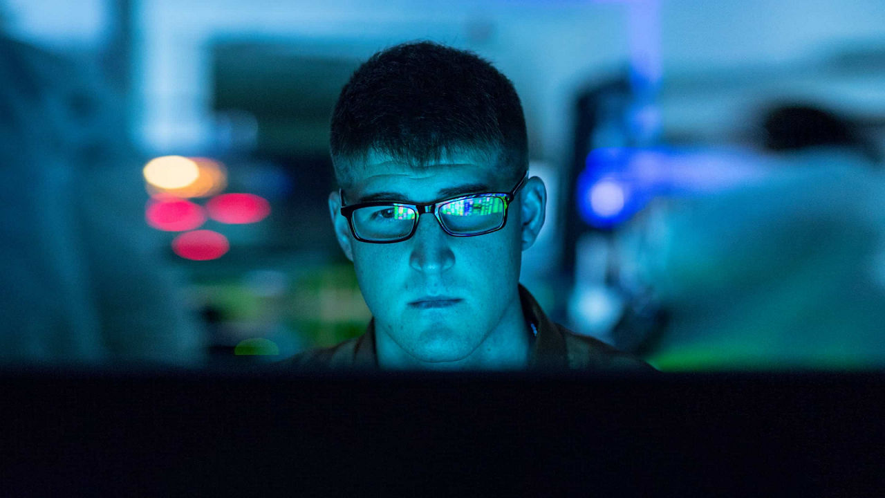 man looking at monitor