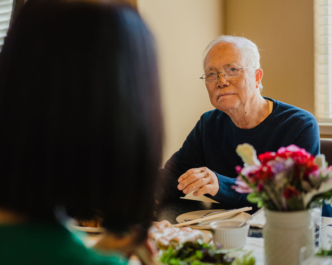 man sitting at dinner table