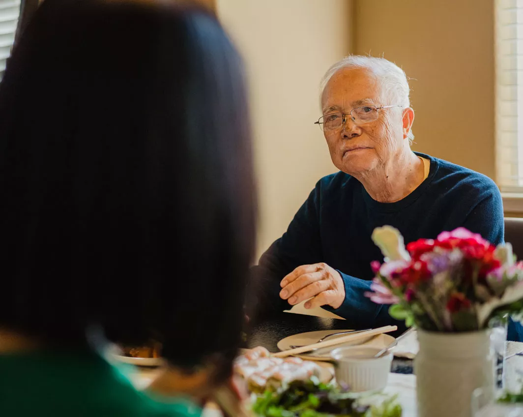 man sitting at dinner table