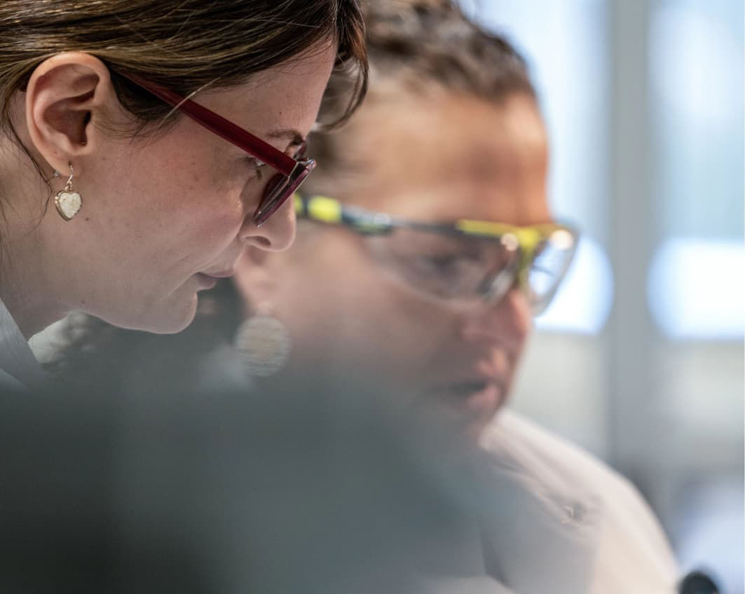 man and woman looking at computer
