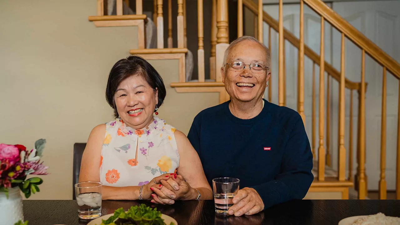man and woman sitting in dining area