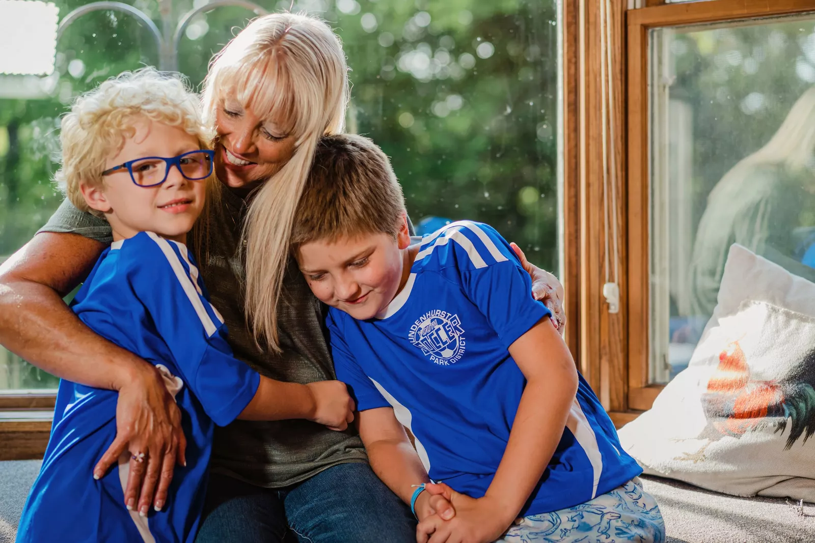mother-hugging-two-children