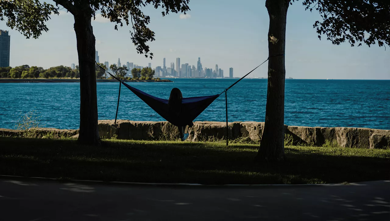 sitting in hammock by lake 