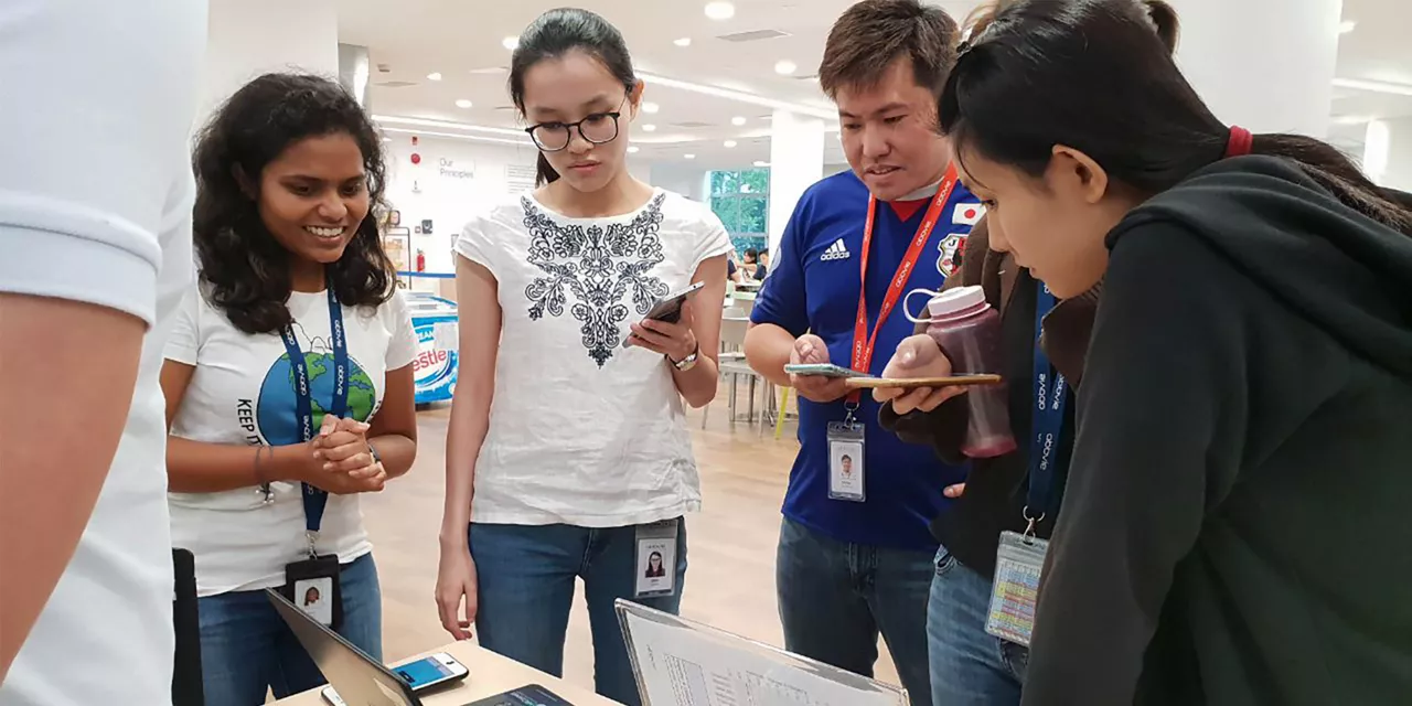 students looking at laptop