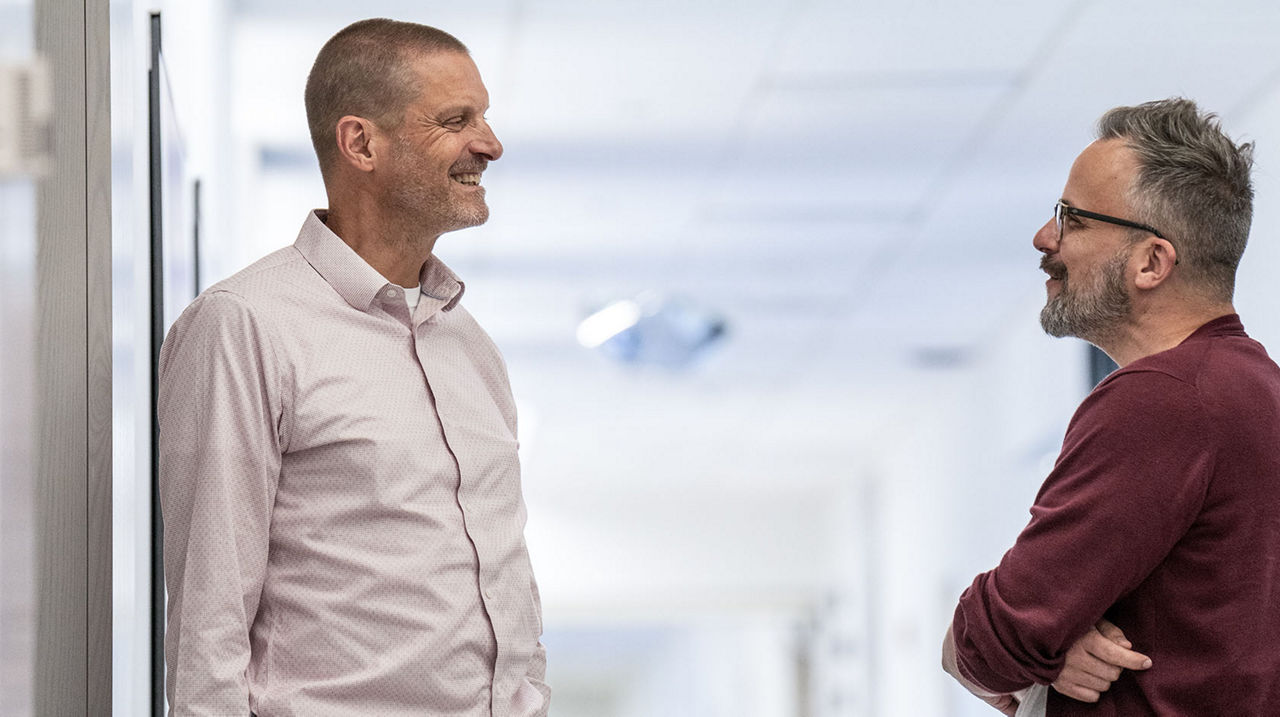 two men talking together