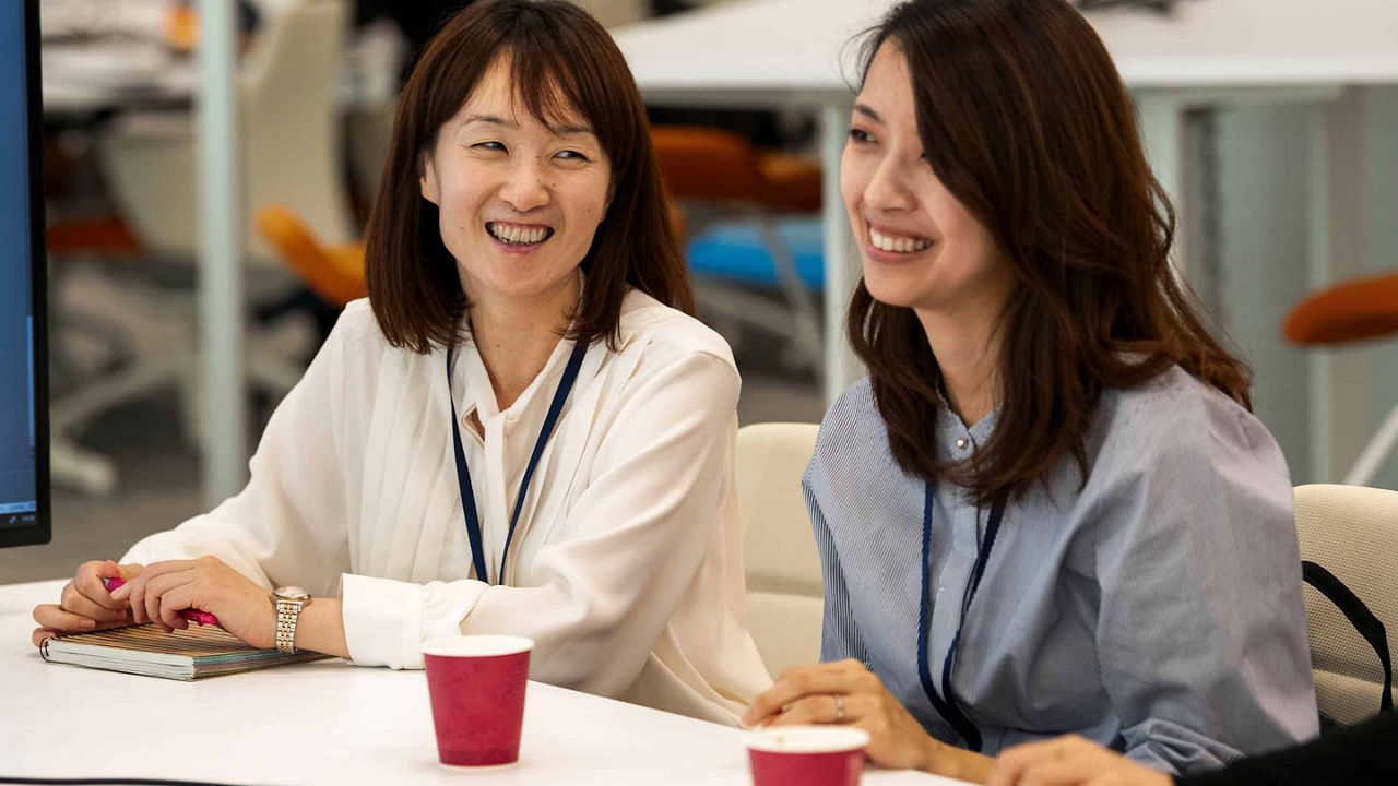 two women smiling 