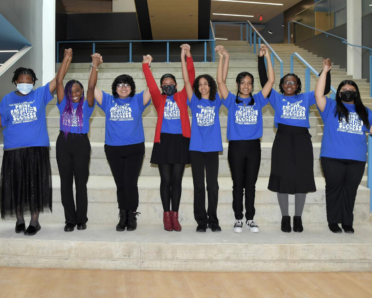 kids holding and raising hands
