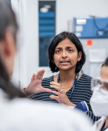 woman in lab speaking