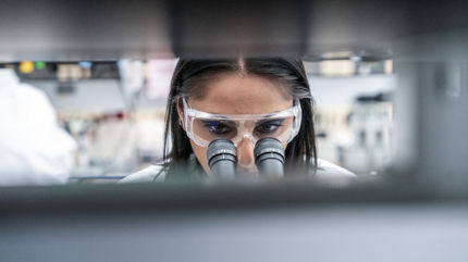 woman scientist microscope